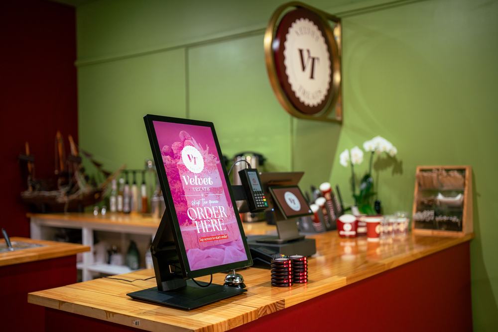 Counter detail with the kiosk and the VT roundel behind