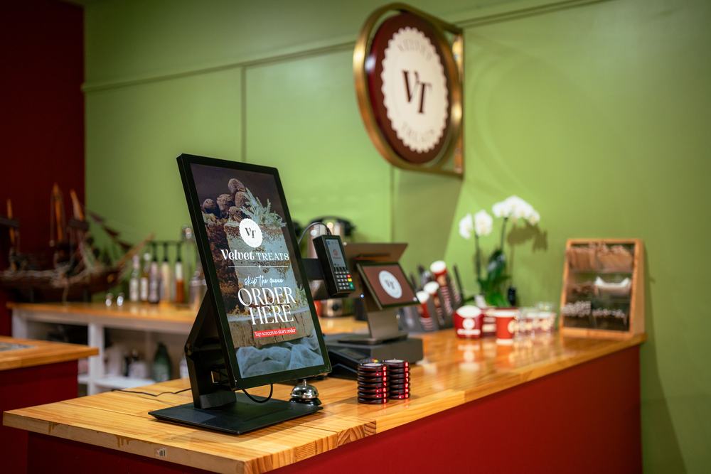 The self-order kiosk beside the counter