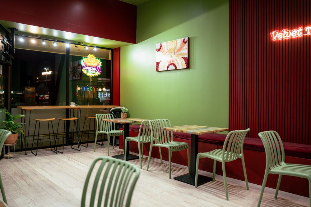 Window seating and bar stools at night